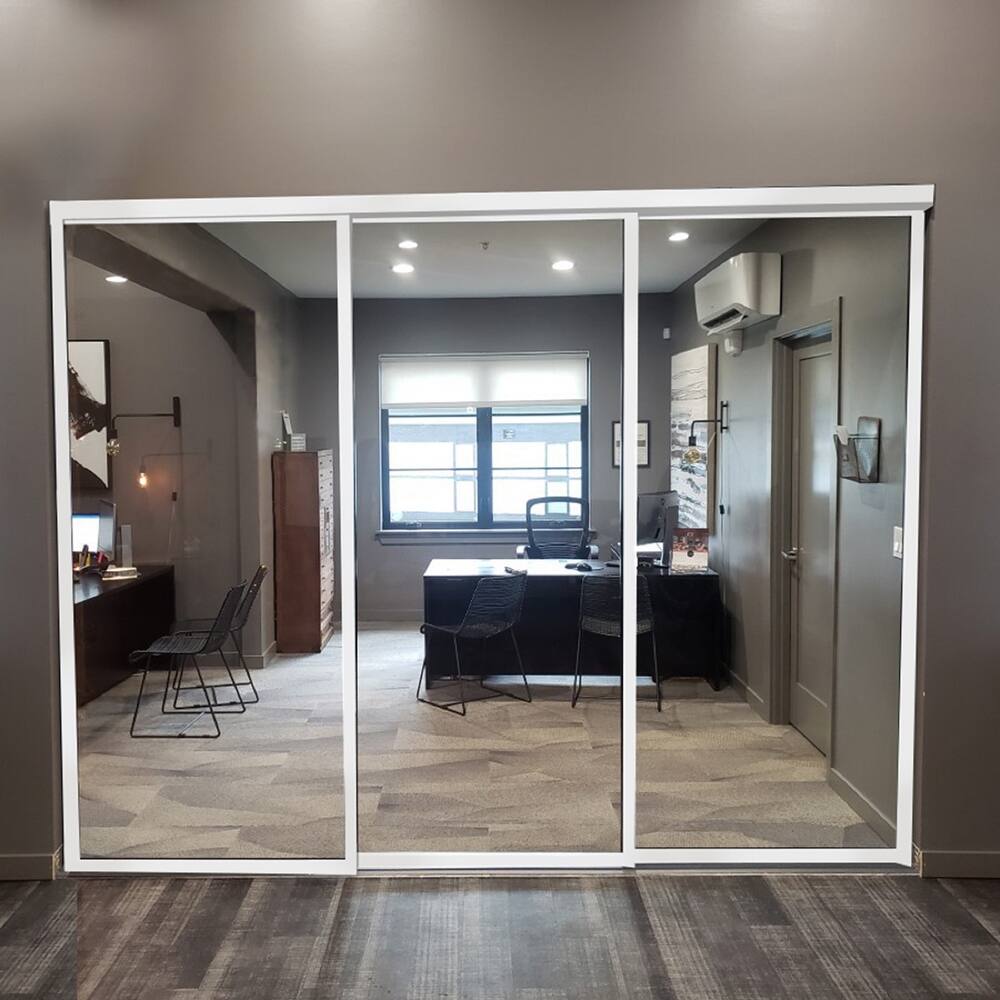 THE SLIDING DOOR COMPANY 3 Panel, Sliding Room Divider, Clear Glass and Aluminum Frame on triple track.