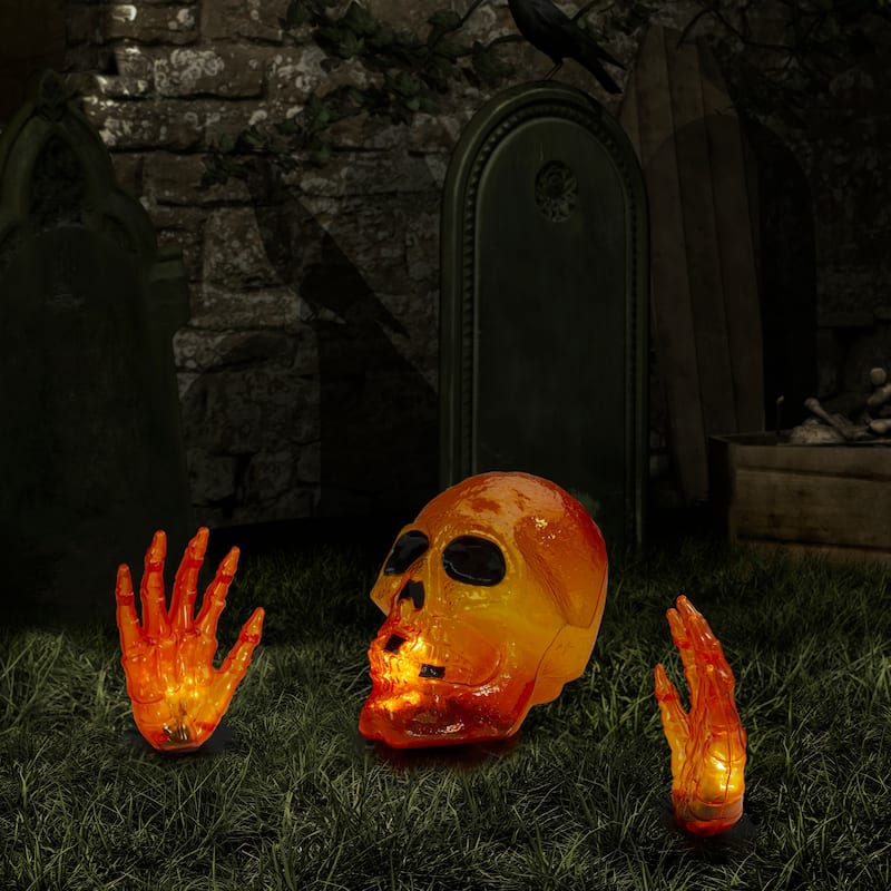 8.5" Lighted Orange Skull and Hands Outdoor Halloween Decoration - 4ft Black Wire