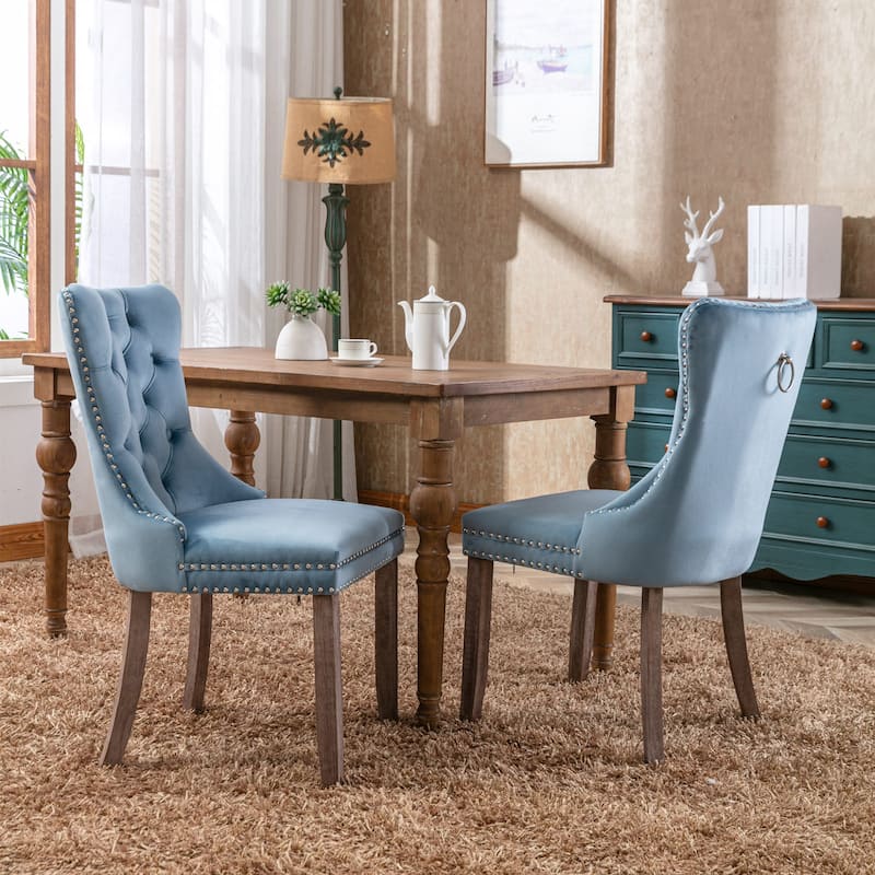 Contemporary Velvet Upholstered Dining Chair with Solid Wood Legs and Nailhead Trim, Offering Luxurious Comfort and Style.