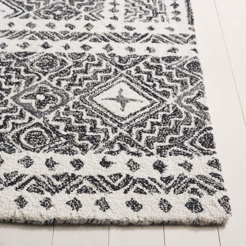 SAFAVIEH Handmade Micro-Loop Jelske Wool Rug