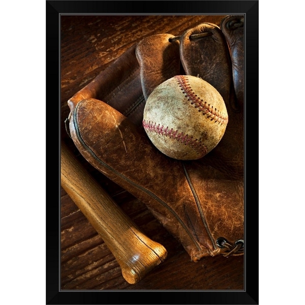 "Antique baseball on baseball glove with bat" Black Framed Print