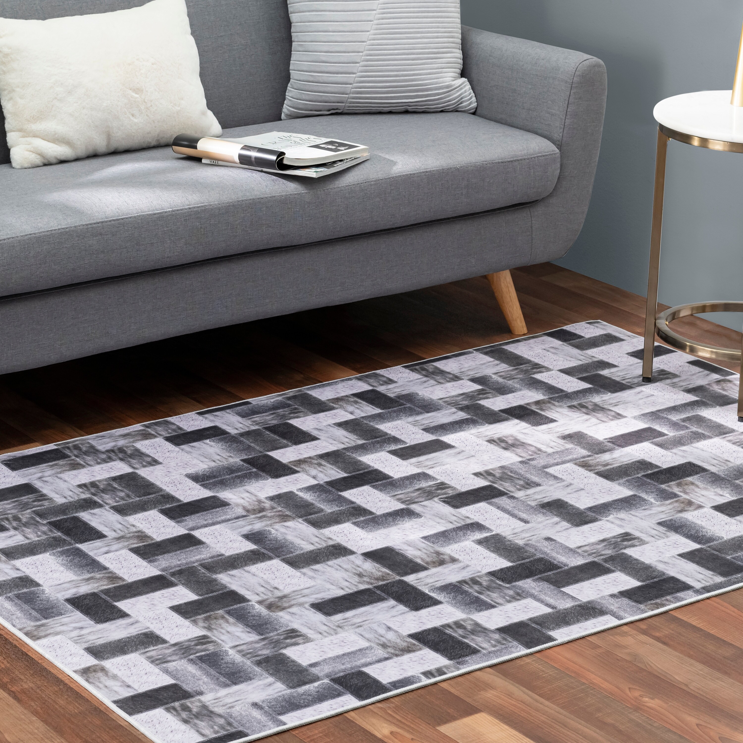 https://ak1.ostkcdn.com/images/products/is/images/direct/27d16c9dfa3c263ad9530c837723f7f85d226f37/Faux-Cowhide-Contemporary-Area-Rug-Patchwork-Off-the-Blocks-Polyester-Rug-With-Cotton-Canvas-Backing.jpg