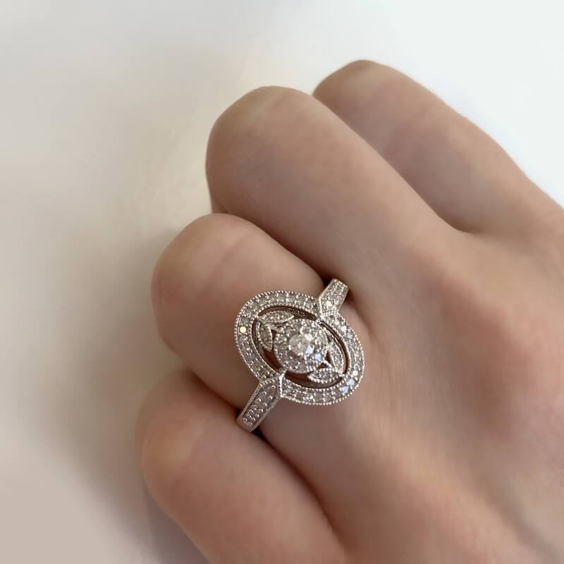1/4ct TDW Diamond Floral Halo Engagement Ring in Sterling Silver by Miadora