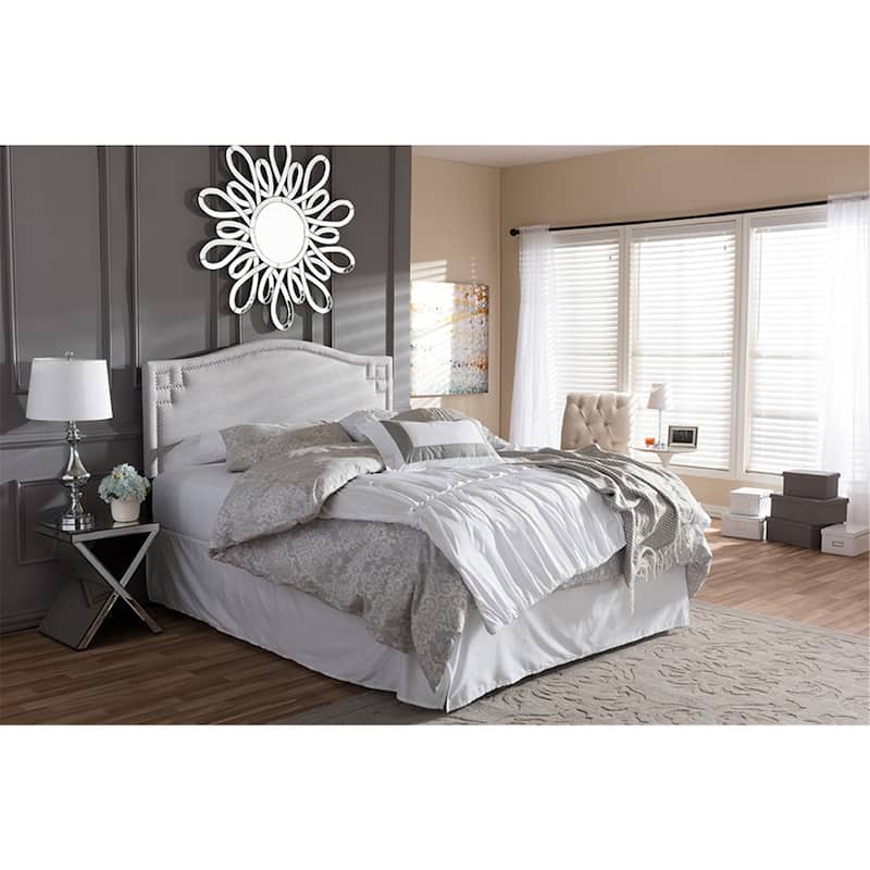 Glamorous Upholstered Fabric Headboard with Nailhead Detailing and Adjustable Height for a Luxurious Bedroom