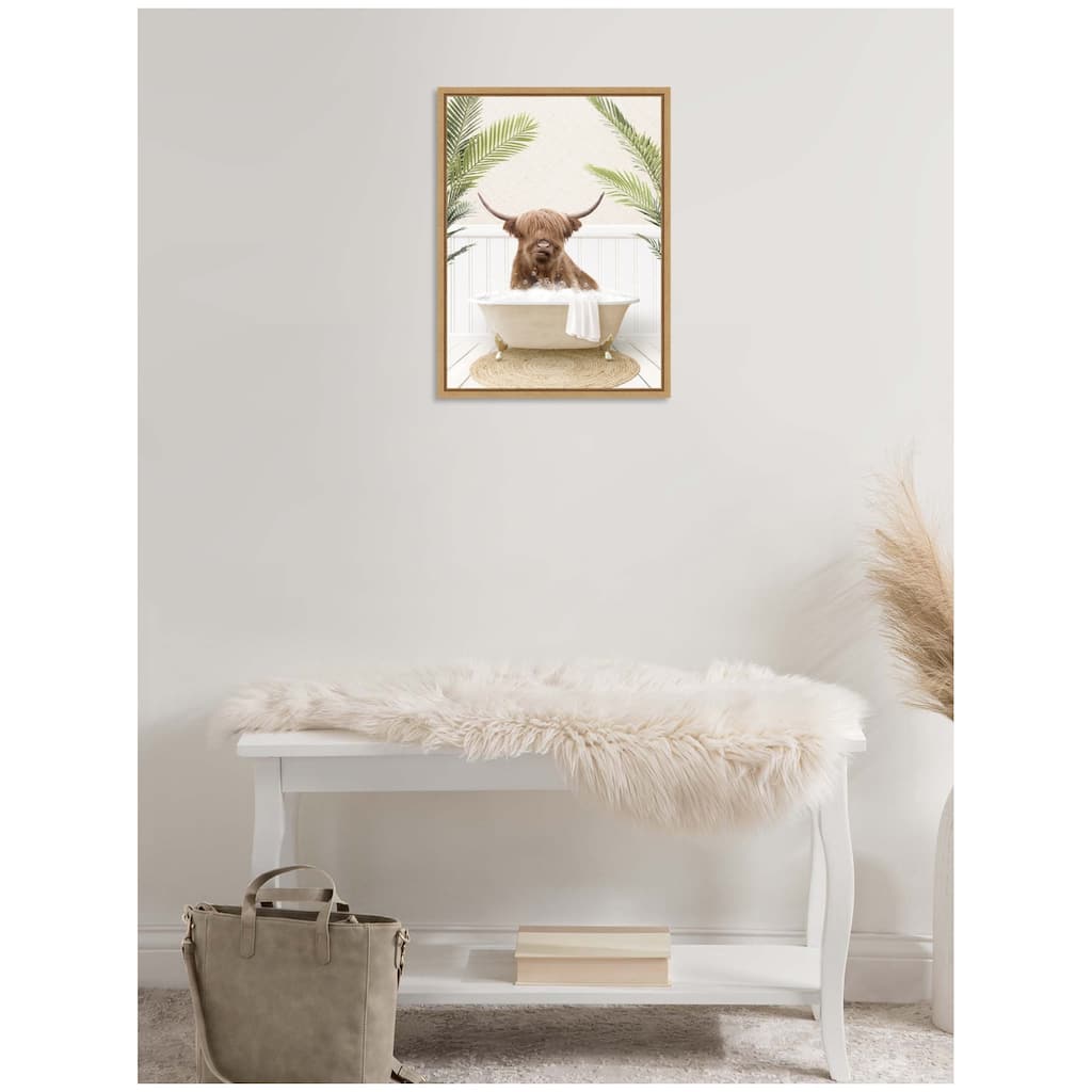 Kate and Laurel Sylvie Highland Cow in Palm Bathtub Framed Canvas by Amy Peterson