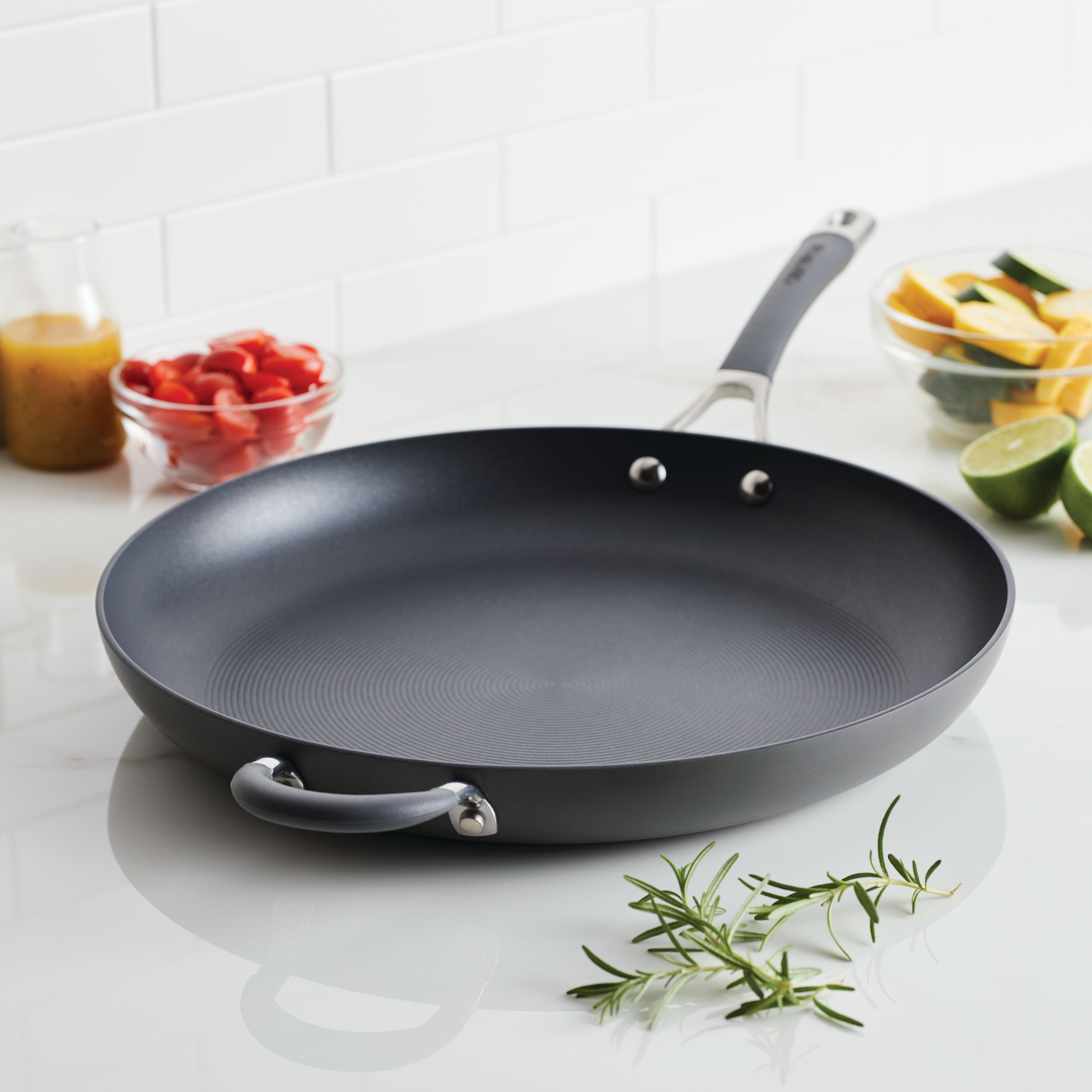 https://ak1.ostkcdn.com/images/products/is/images/direct/28a4c79a8f5793d418f50c96d5e753963f271f2d/Circulon-Radiance-Hard-Anodized-Nonstick-Frying-Pan-with-Helper-Handle%2C-14-Inch%2C-Gray.jpg