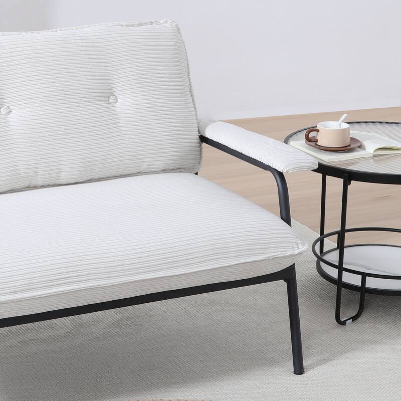 The 53-inch black sofa offers a spacious layout in the small apartment