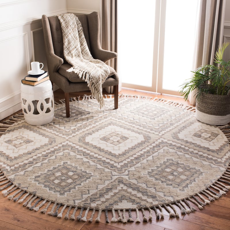 SAFAVIEH Handmade Aspen Ksenia Moroccan Boho Wool Tassel Rug - 7' Round - Taupe/Ivory