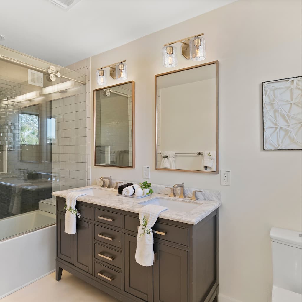 Haven 16 in. 2-Light Old Satin Brass Vanity Light with Clear Rippled Glass Shades for Bathrooms