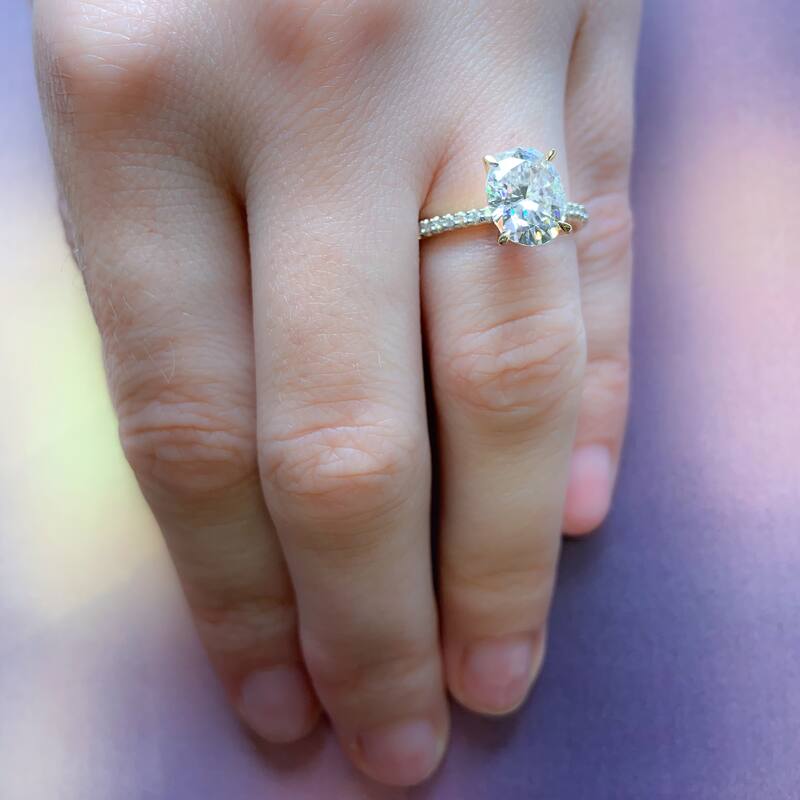 Miadora 2ct DEW Oval-cut Moissanite and 1/10ct TDW Diamond Engagement Ring in 14k Yellow Gold