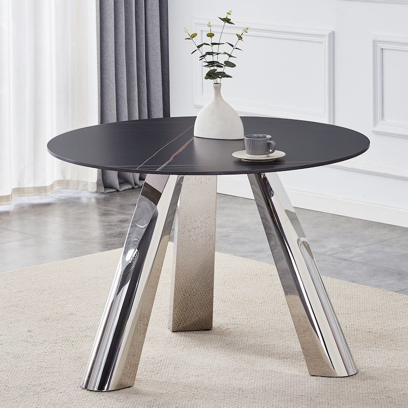 A 42-Inch Round Table with Stainless Steel Legs and a Marble Top, Perfect for 4 to 6 People.