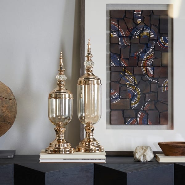 slide 2 of 5, CosmoLiving by Cosmopolitan Gold Metal Decorative Jars with Finial Lids (Set of 2) - S/2 22", 19"H