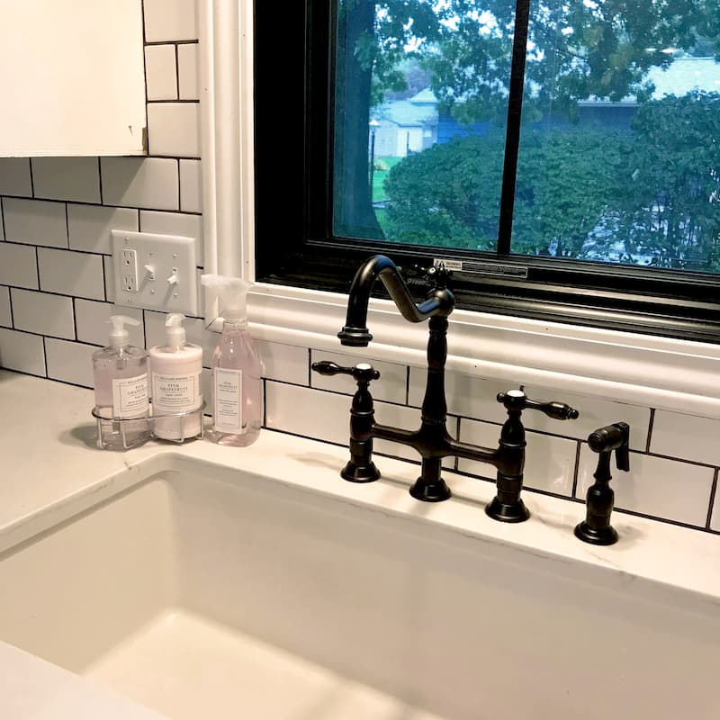 Kingston Brass Tudor Bridge Kitchen Faucet with Brass Sprayer