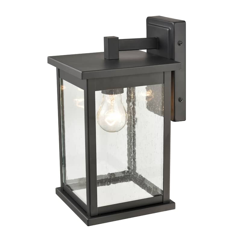 Millennium Lighting Bowton 1 Light Outdoor Wall Sconce in Powder Coat Black with Clear Glass Shade