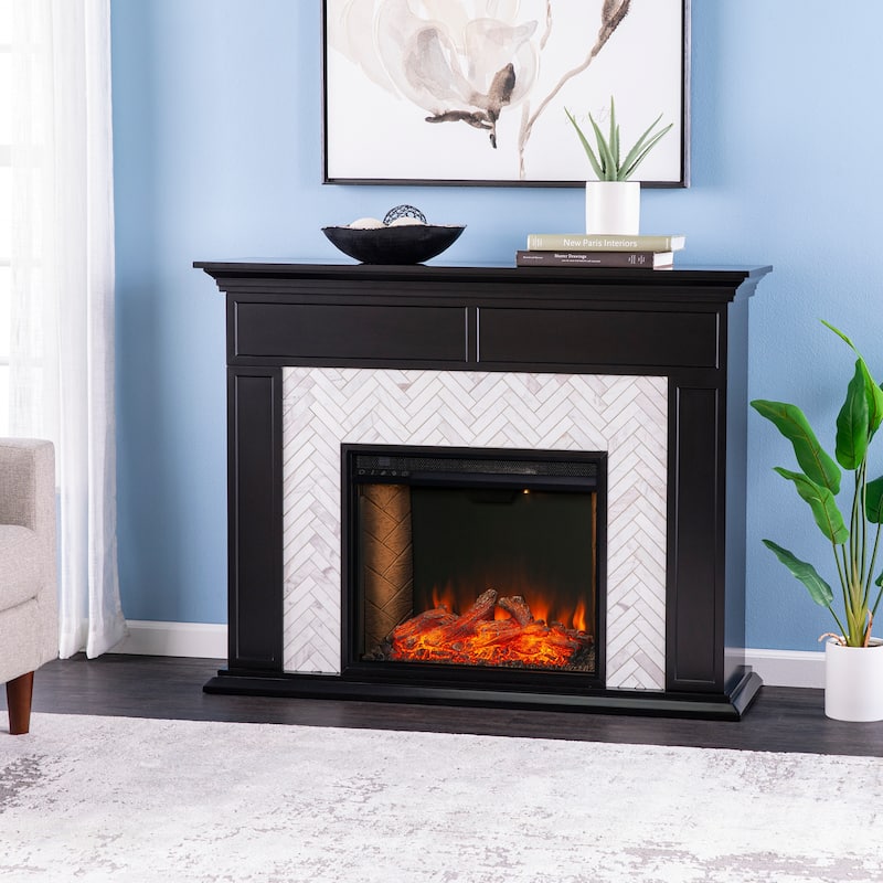 SEI Furniture Torton Contemporary Electric Fireplace with Chevron Marble Tiled Mantel - Brick Accent Firebox w/ Black Mantel