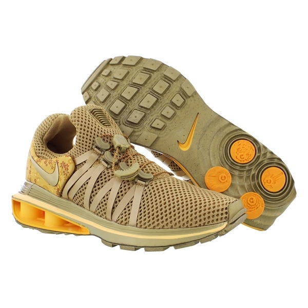 nike shox gravity women's gold
