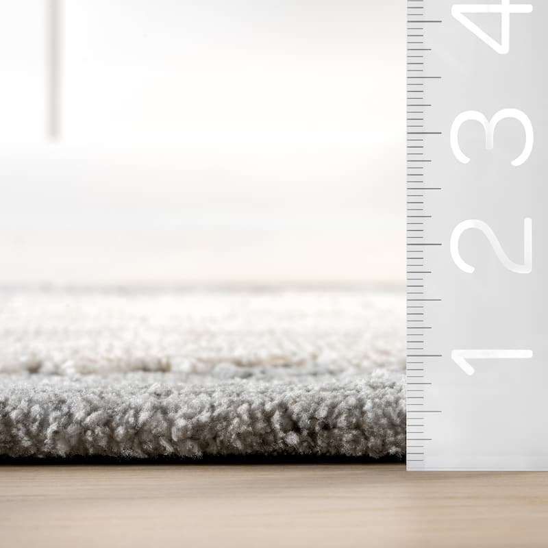 Mera Bordered Wool Area Rug