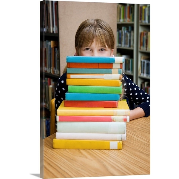 "Girl looking over stack of books" Canvas Wall Art