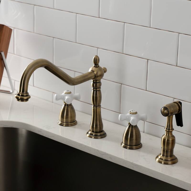 Kingston Brass Heritage Deck Mount Widespread Kitchen Faucet with Brass Sprayer
