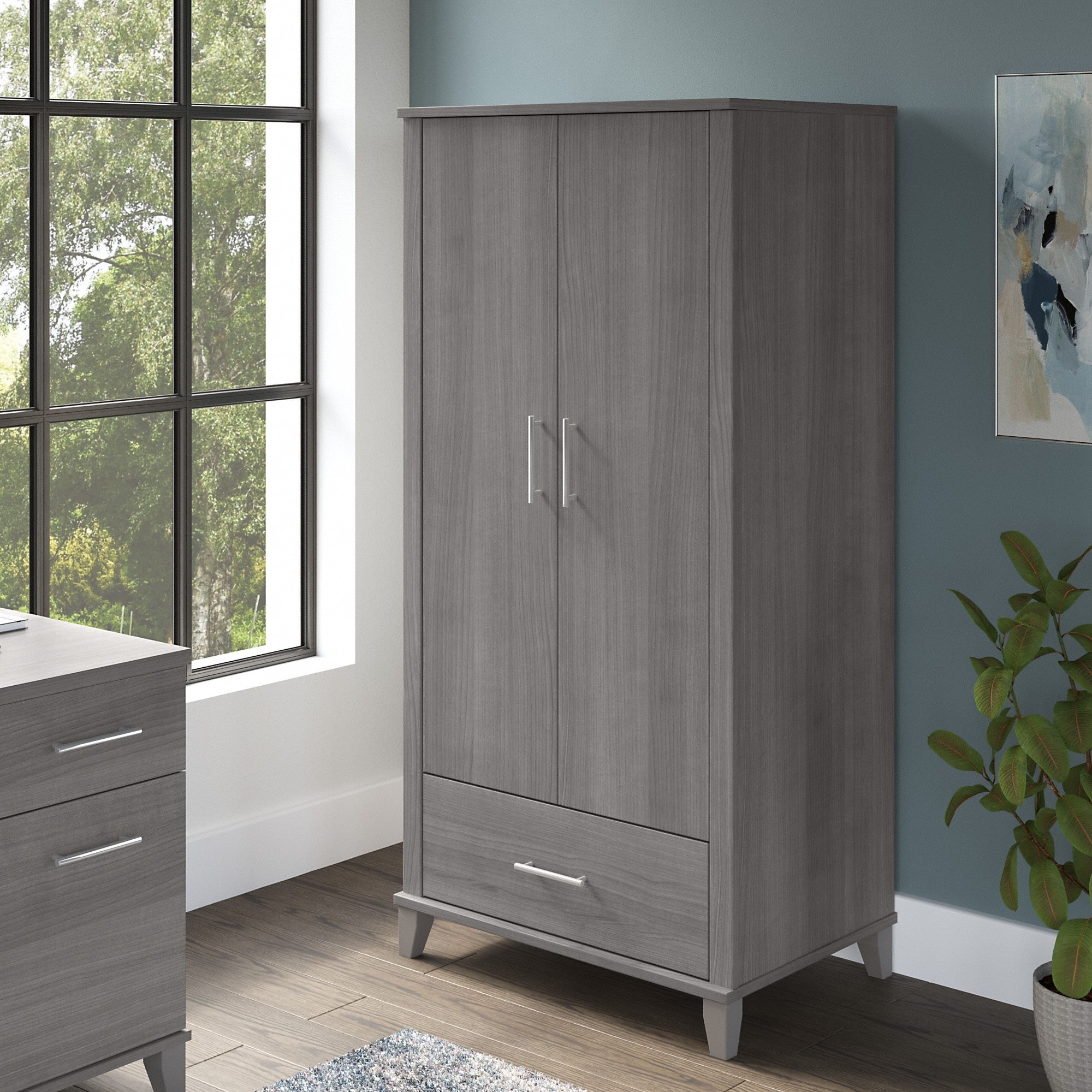https://ak1.ostkcdn.com/images/products/is/images/direct/2bdf1cb7ab84eefea183d2bb5bead395b3575fd1/Somerset-Tall-Storage-Cabinet-with-Doors-and-Drawer-by-Bush-Furniture.jpg