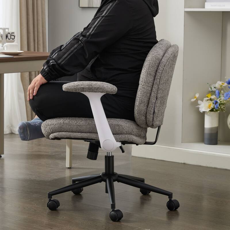 Grey Swivel Chair with Flip-Up Armrests and Crossed Legs