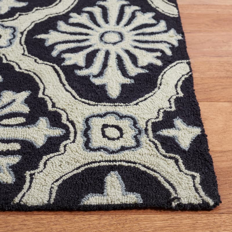 SAFAVIEH Handmade Easy Care Vaxhide Oriental Rug