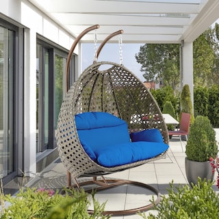 LeisureMod 2-Person Hanging Egg Swing Chair with Metal Stand - Handcrafted Beige Wicker, Patio Hammock Lounger with Cushions