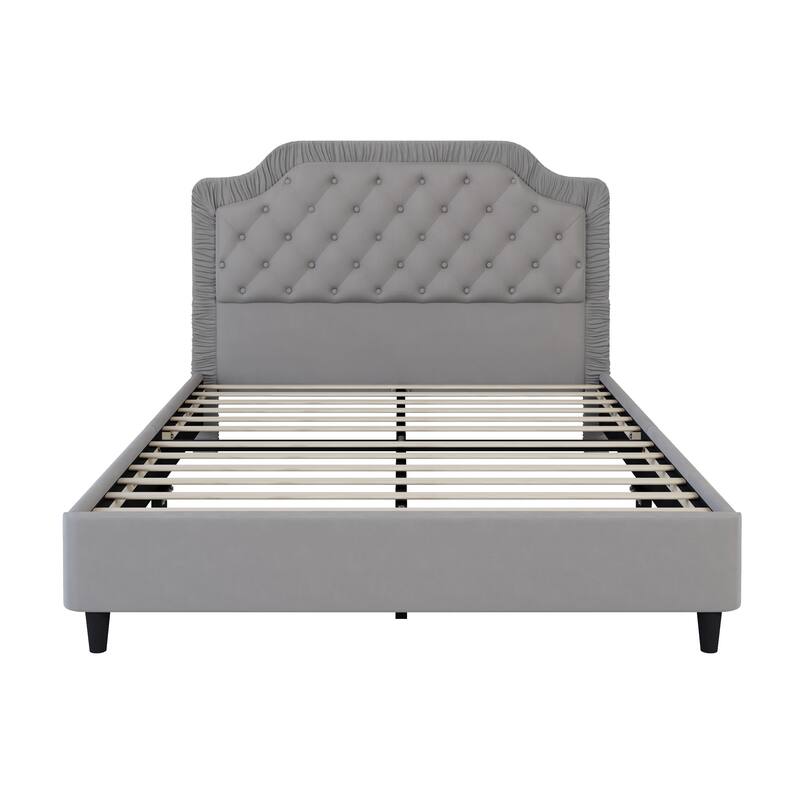 Upholstered bed with pleated trim and button tufted headboard