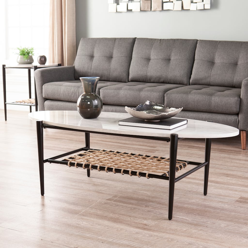 SEI Furniture Raleigh Faux Marble Oval Coffee Table with Natural Woven Shelf