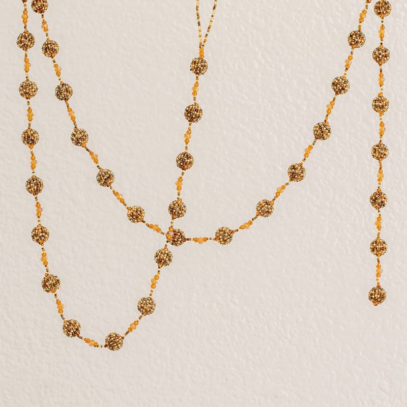 Glass beaded garland, 'Golden Silhouettes'