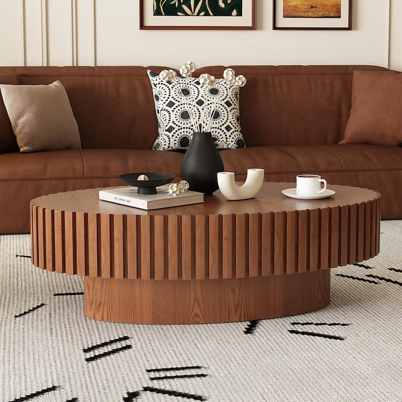 Oval Wooden Coffee Table with Handcrafted Relief and Sturdy Pedestal for Living Room