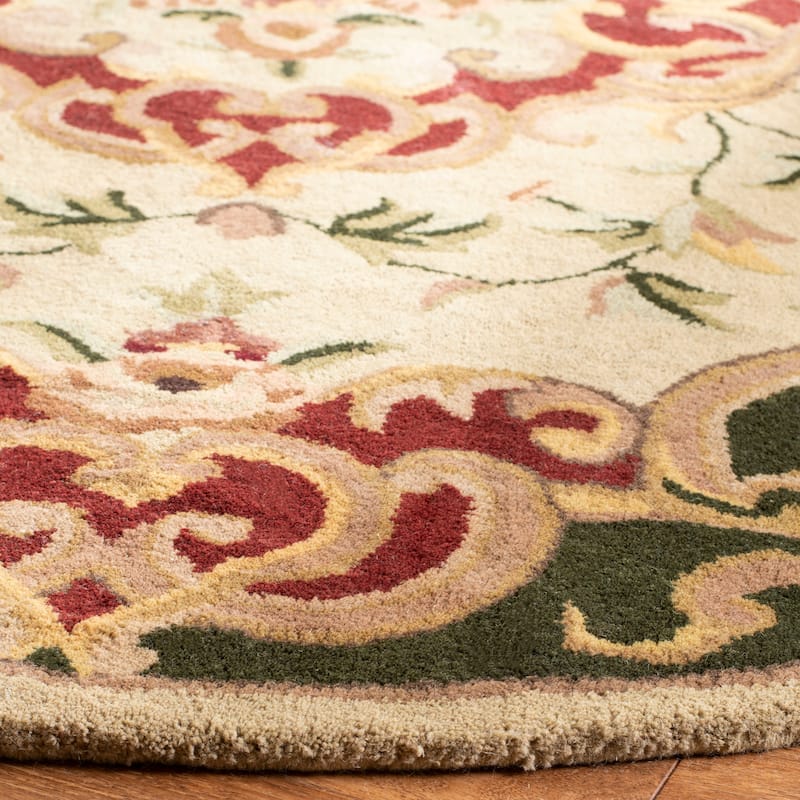 SAFAVIEH Handmade Classic Selvaggia Traditional Oriental Wool Rug - 7'6" x 9'6" Oval - Ivory/Green