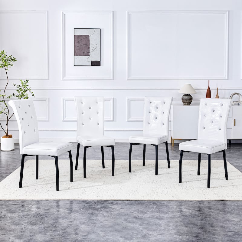A set of 4 white and black vintage crocodile leather cushioned dining chairs, featuring crystal clasp design and leather