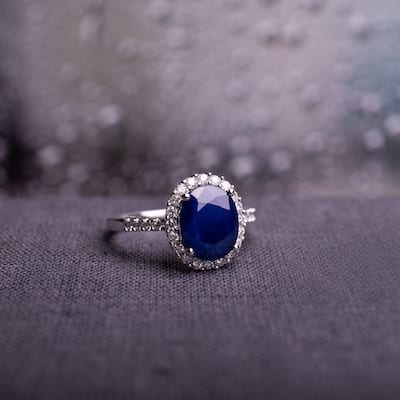 Diffused Sapphire and 2/5ct TDW Diamond Oval Halo Ring in 14k White Gold by Miadora