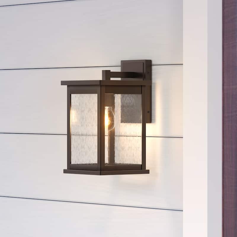 Millennium Lighting Bowton 1 Light Outdoor Wall Sconce in Powder Coat Bronze with a Clear Glass Shade