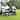 Outsunny Camping Kitchen Table, Portable Folding Camp Kitchen, Aluminum Cook Station with 3 Fabric Cupboards, Windshield