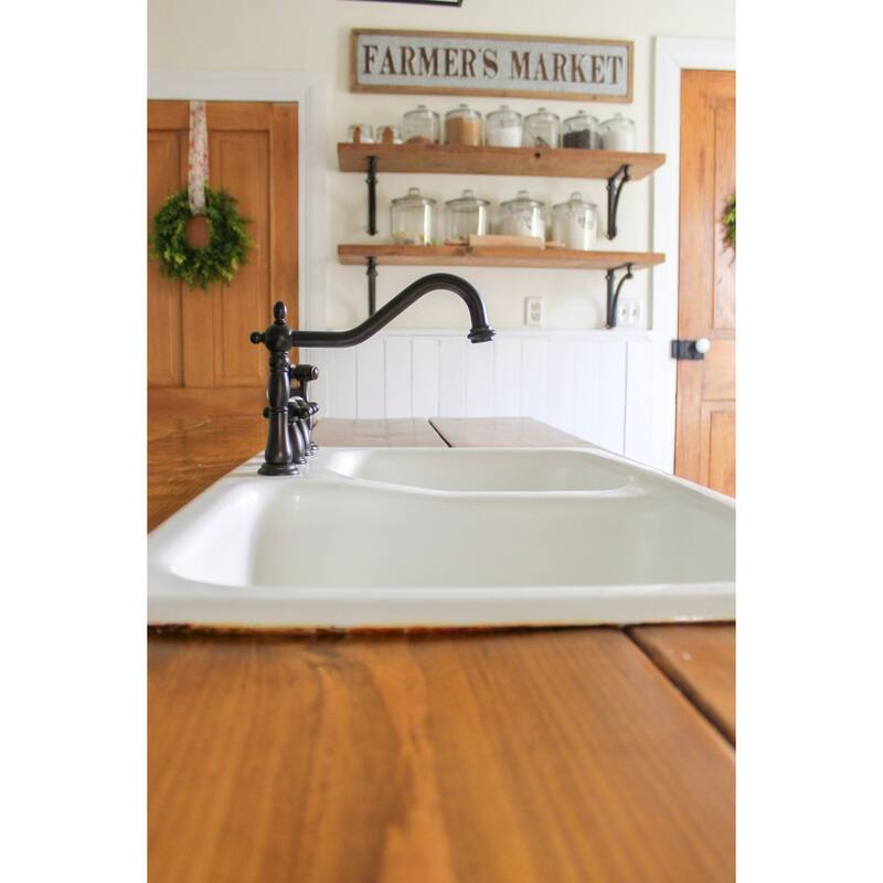 Kingston Brass Heritage 8-Inch Widespread Kitchen Faucet with Brass Sprayer