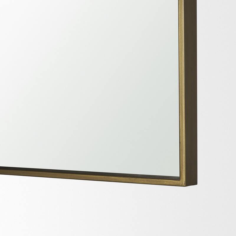 Timon is a square mirror with an arched brushed gold metal frame. - 36.0L x 1.8W x 34.3H
