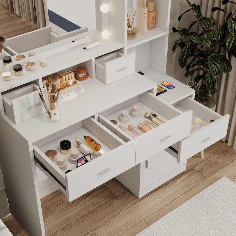 The vanity with a mirror is equipped with a hair dryer rack