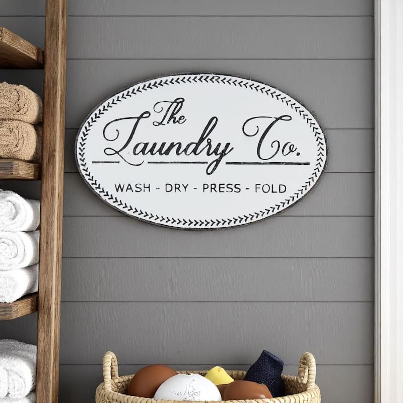 HomeRoots 14" X 22" White And Dark Gray The Laundry Co Metal Oval Wall Decor - White/Gray - 22 in. x 14 in.  x 1.25 in.