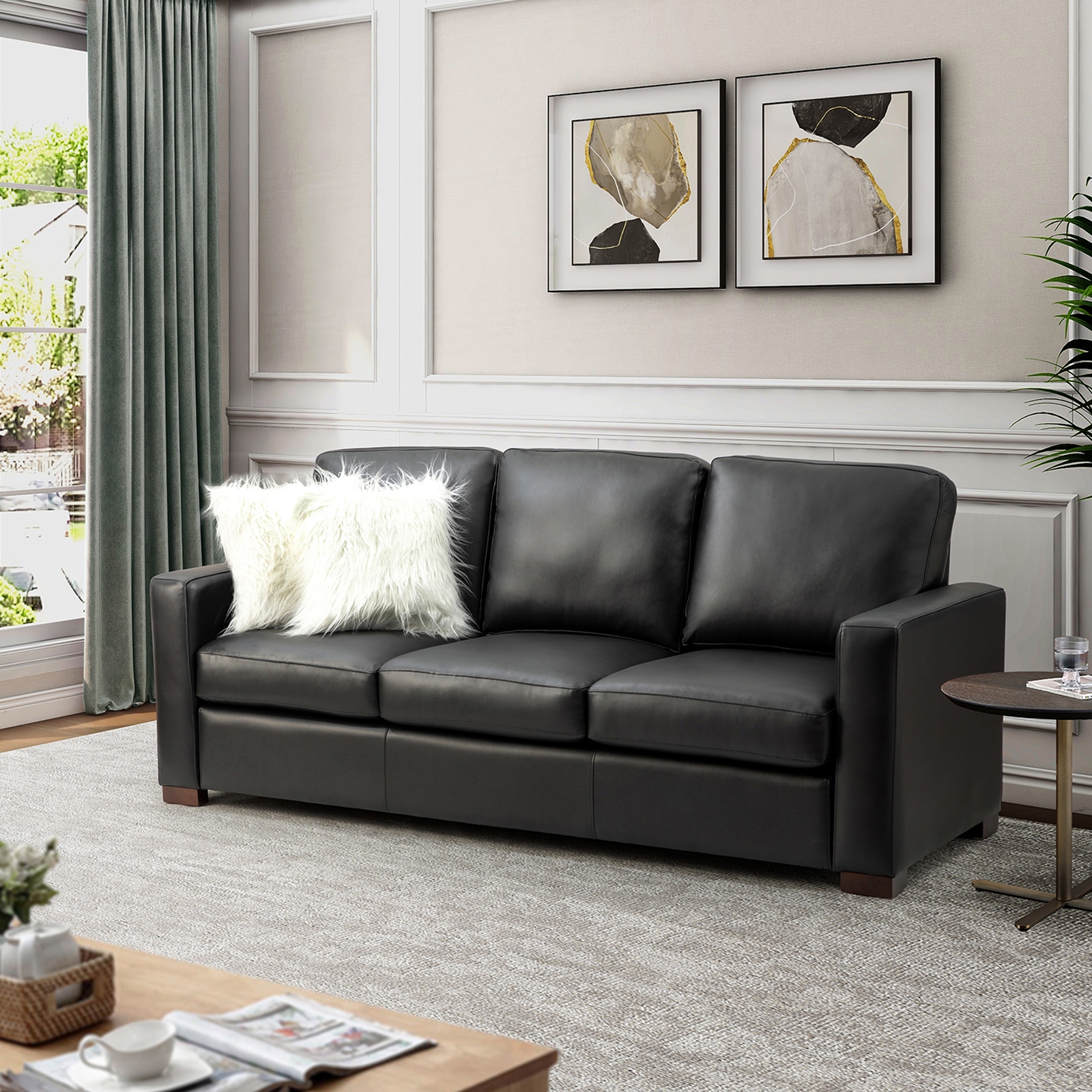 Black leather best sale sofa with pillows