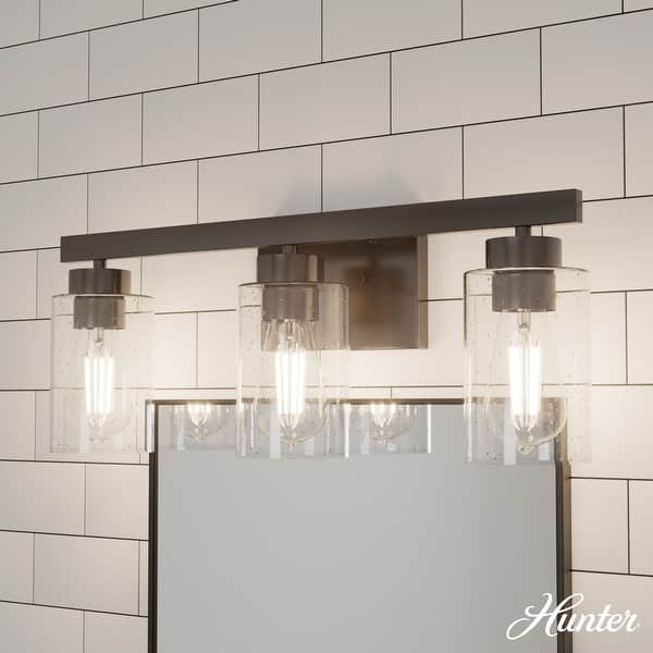 slide 2 of 5, Hunter Hartland Bathroom Vanity Wall Light, Damp Rated - Transitional, Rustic, Contemporary - Clear Seeded Glass 3-Light - Noble Bronze