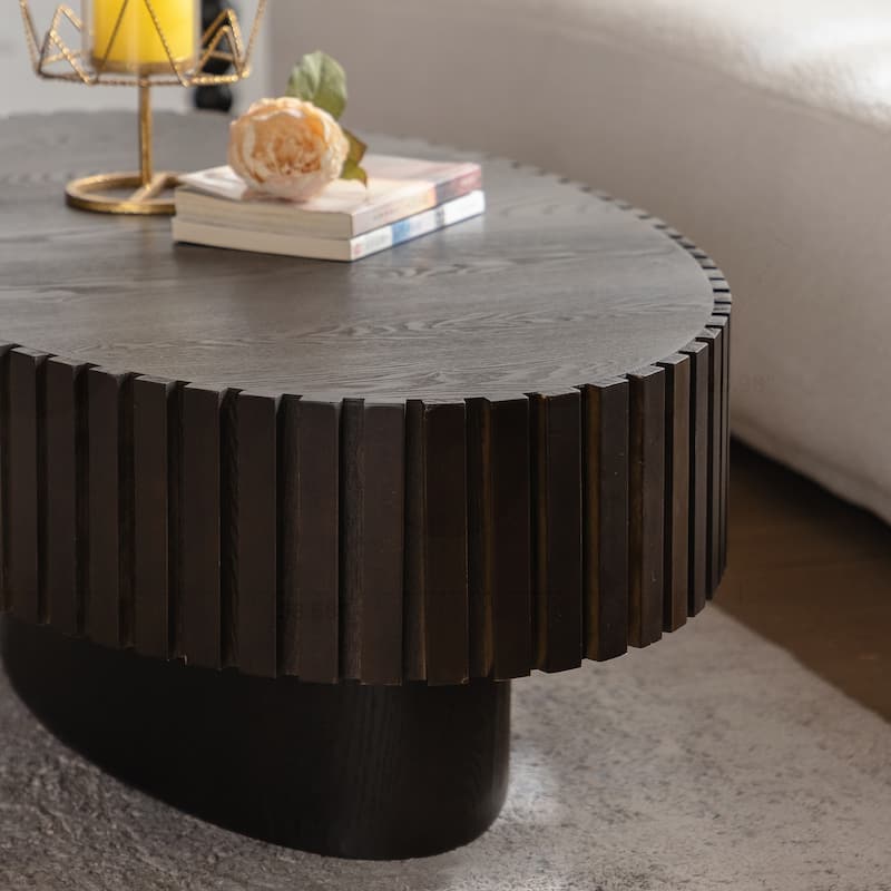 Oval Wooden Coffee Table with Handcrafted Relief and Sturdy Pedestal for Living Room