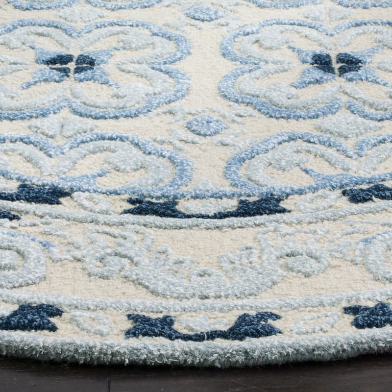 SAFAVIEH Handmade Bella Nursel Modern Floral Wool Rug
