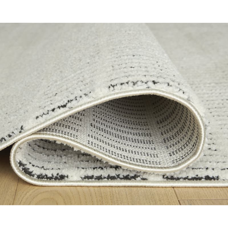 Signature Design by Ashley Turinwith Beige/Black Area Rug