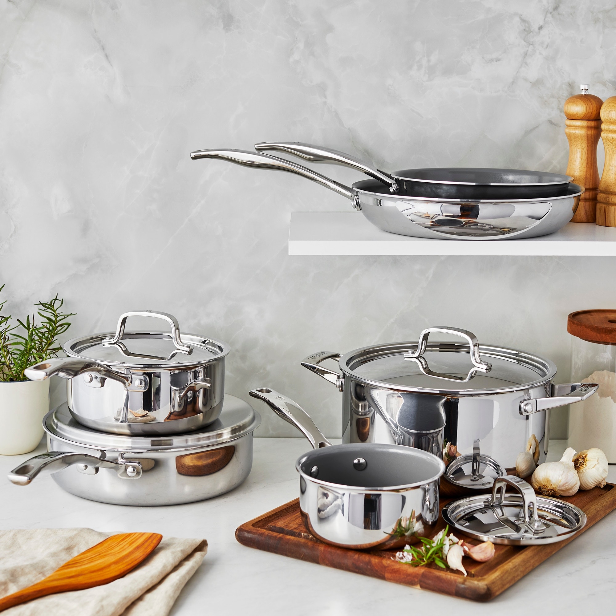 https://ak1.ostkcdn.com/images/products/is/images/direct/31f88cebce49fd19c6a2c5eae72eb45e6c3c6232/Henckels-Clad-Alliance-10-pc-Stainless-Steel-Cookware-Set.jpg