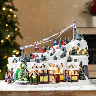 Glitzhome 16"H Christmas Oversized Resin Lighted Musical Skiing Table Village Decor