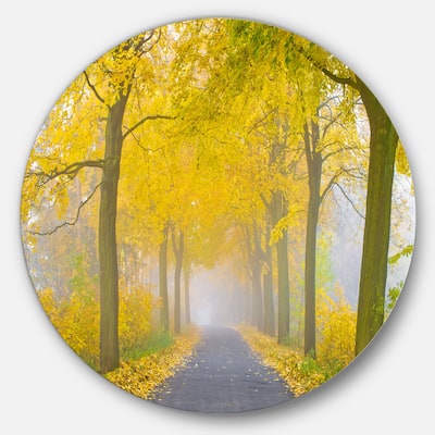 Designart 'Misty Road in Yellow Autumn Forest' Landscape Photo Disc Metal Artwork