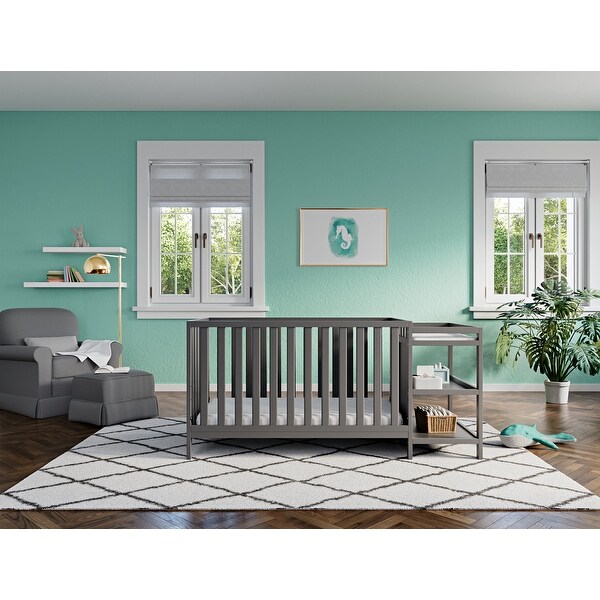 Storkcraft Pacific 4-in-1 Convertible Crib and Changer - 2 Open Shelves, Water-Resistant Vinyl Changing Pad with Safety Strap. Opens flyout.