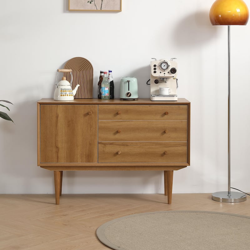 An antique buffet in oak color
